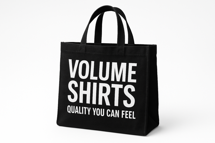  A durable black canvas tote bag with a catchy promotional slogan printed in large, bright white lettering across the front. The crisp, high-contrast print makes the bag a standout for trade shows or community events, reinforcing brand visibility.