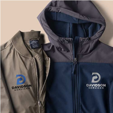 Two jackets, one gray and one navy, with embroidered logo on a beige background 

Custom jackets
Embroidered apparel
Corporate jackets
Professional outerwear
Branded clothing
Workwear jackets
Logo embroidery
Business uniforms
Stylish jackets
High-quality jackets
Gray corporate jackets
Navy business jackets
Embroidered workwear
Davidson Services apparel
Custom logo jackets