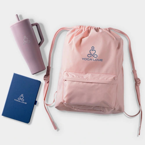 Pink drawstring bag, purple tumbler, and blue notebook with branding and logo on a white background.